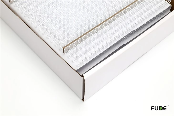 Close-up of white double loop wire and separators inside a box, representative packing